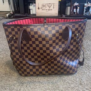 Brown checkered print handbag.